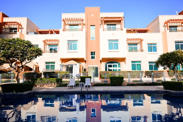 Completed homes and community pool at Al Ghadeer