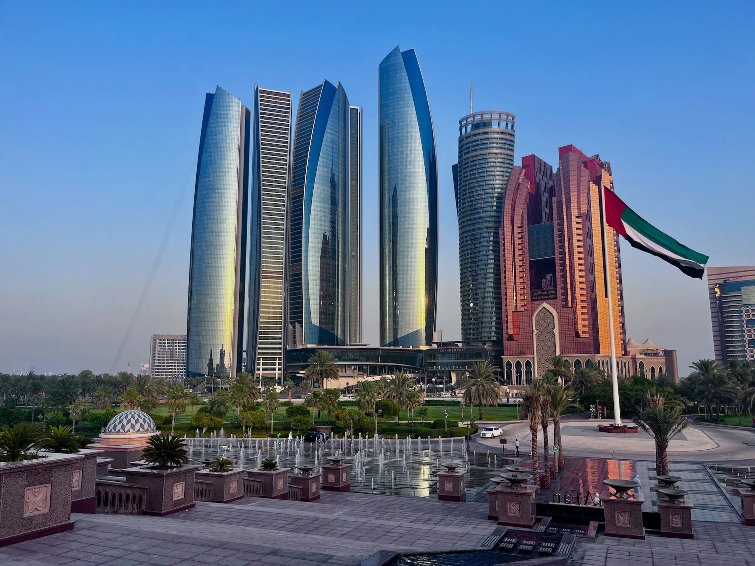 Etihad Towers and the Abu Dhabi skyline seen from the Emirates Palace grounds